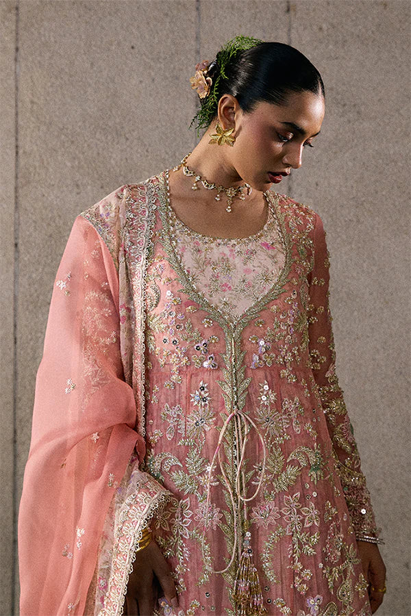 Model wearing rose coral embellished ensemble from Suffuse Novara, Pakistani luxury pret, shop Pakistani clothes online in UK
