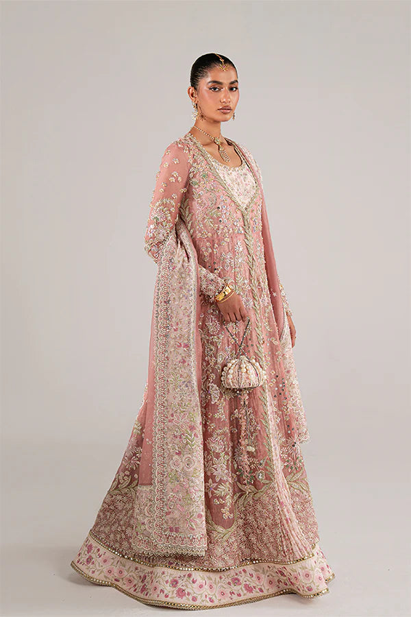 Model wearing rose coral embellished ensemble from Suffuse Novara, Pakistani luxury pret, shop Pakistani clothes online in UK
