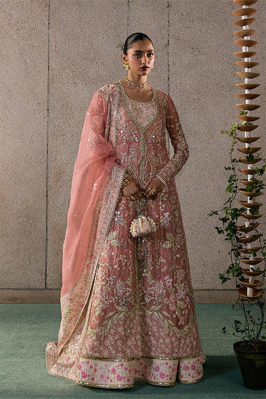 Model wearing rose coral embellished ensemble from Suffuse Novara, Pakistani luxury pret, shop Pakistani clothes online in UK
