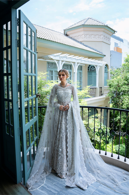 Model wearing silver embellished gown DAHLIA from Mysie by Tahira, Pakistani luxury pret perfect for weddings, now online in UK.