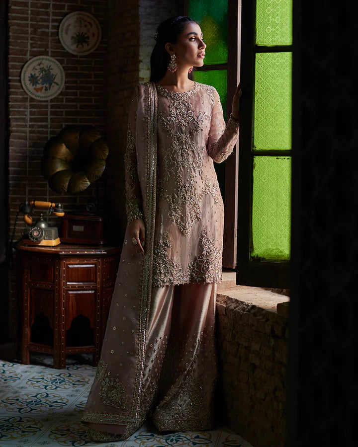 model wearing dusty pink embroidered dress by Faiza Saqlain, Pakistani luxury pret available online in UK