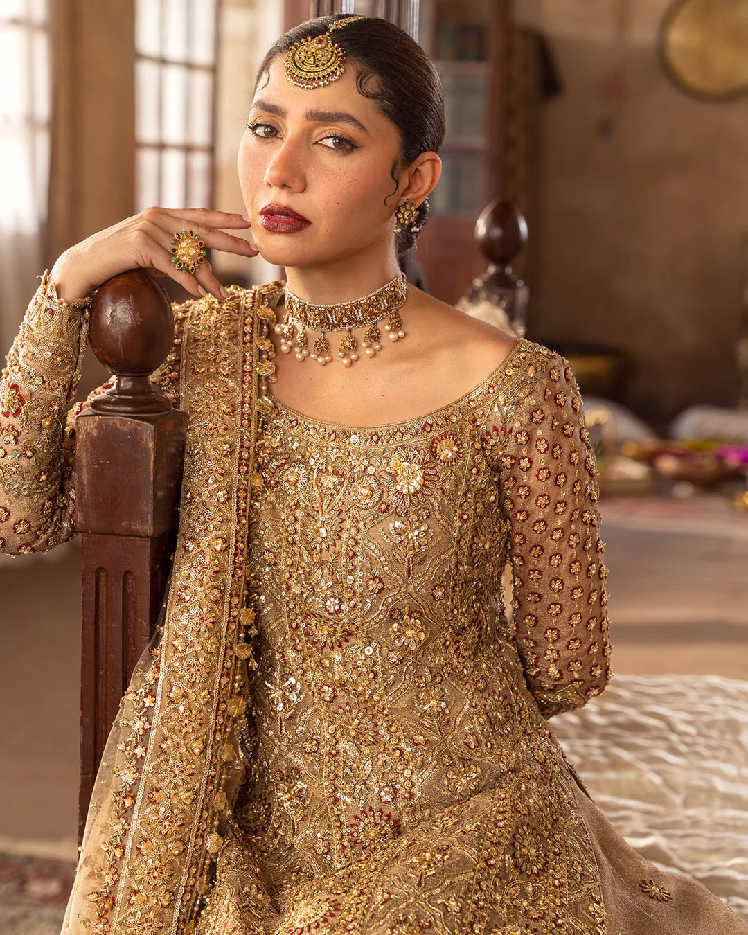 Model wearing golden brown bridal dress Naisha by Faiza Saqlain, Pakistani luxury pret online in UK for weddings.