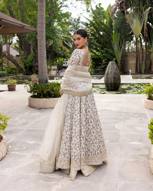 Model wearing cream floral Vinika dress from Faiza Saqlain Zinnia collection, Pakistani Luxury pret, Pakistani clothes online in UK.