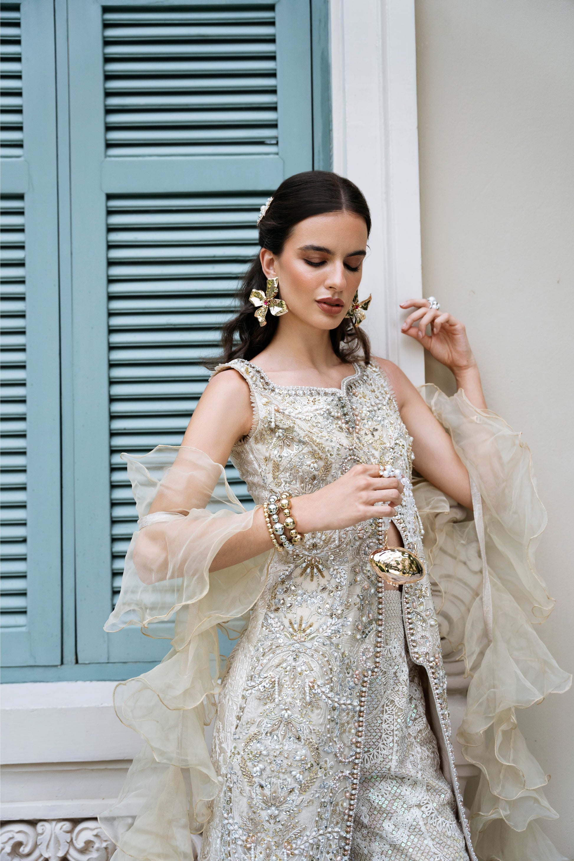 Model wearing Fifi from Mysie by Tahira, a beige embellished outfit with flared pants, perfect for Pakistani luxury pret in the UK.