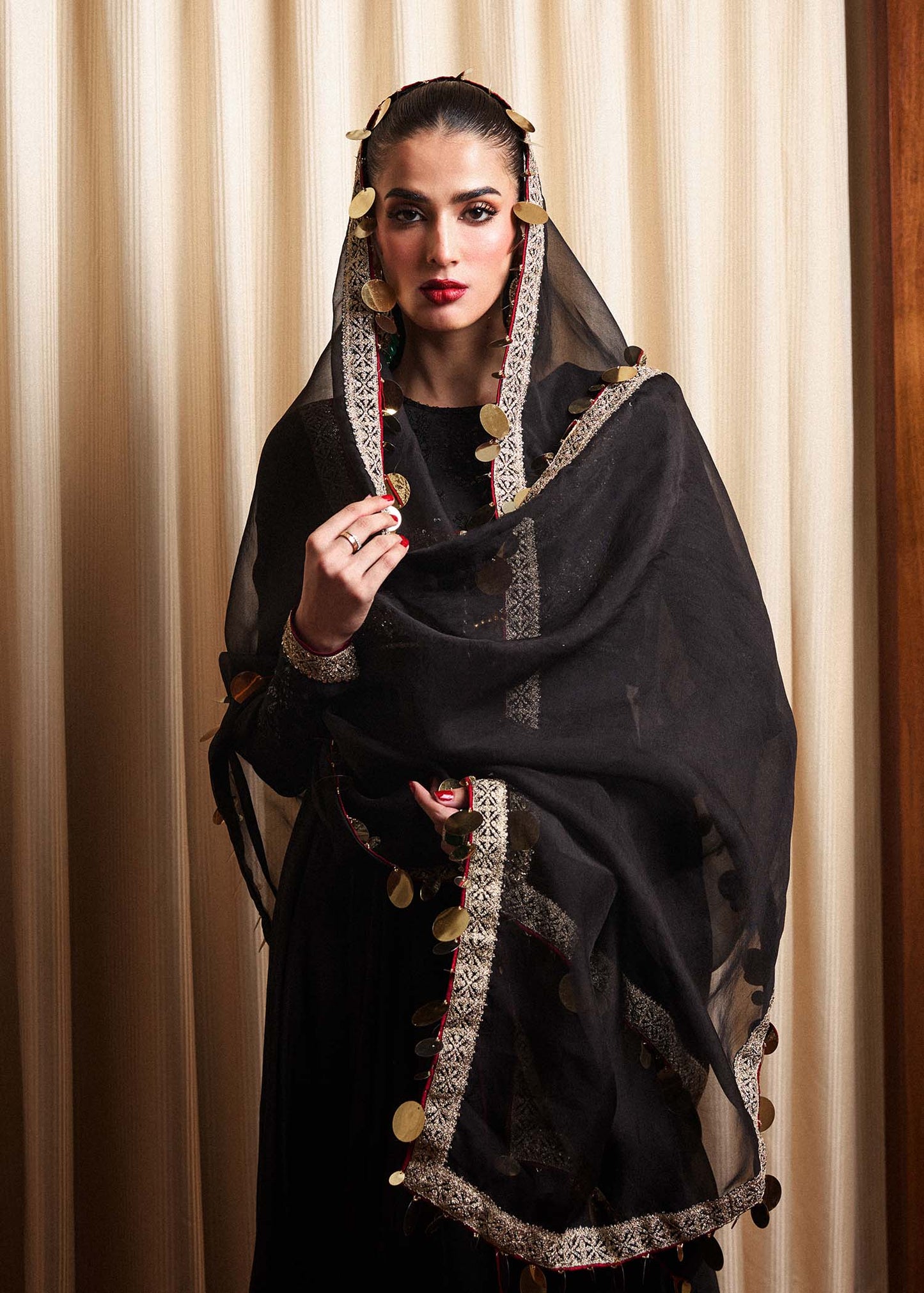 Model wearing a black Rubai dress from Hussain Rehar's Luxury Pret collection. Pakistani clothes online in UK.