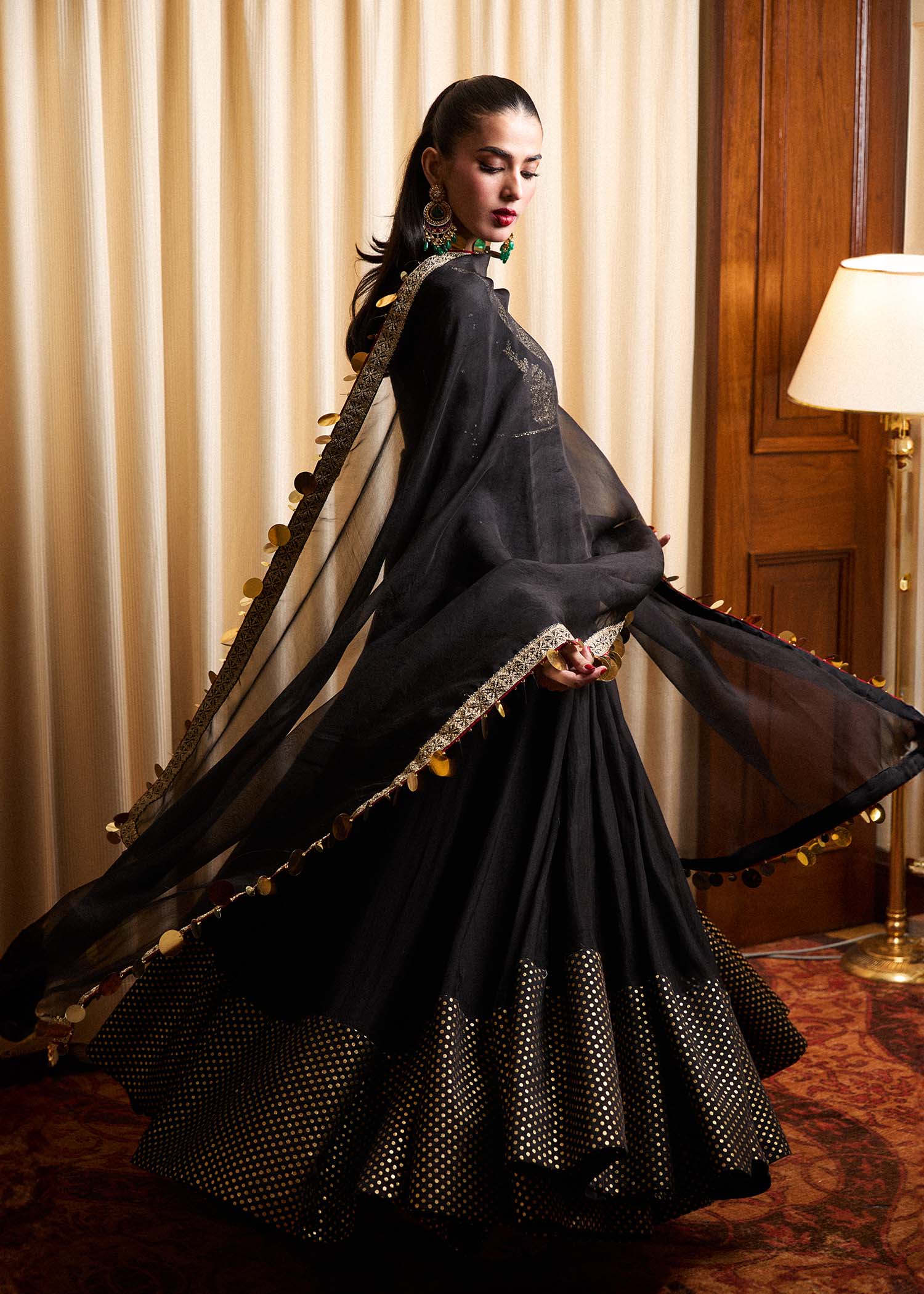 Model wearing a black Rubai dress from Hussain Rehar's Luxury Pret collection. Pakistani clothes online in UK.