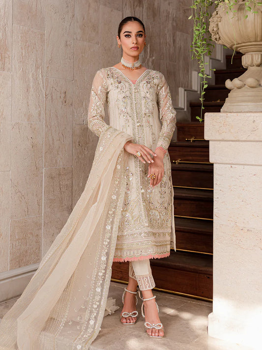 Model wearing ivory Yaram outfit from Gulaal—elegant Pakistani luxury pret, perfect for festive wear, shop Pakistani clothes online in UK.