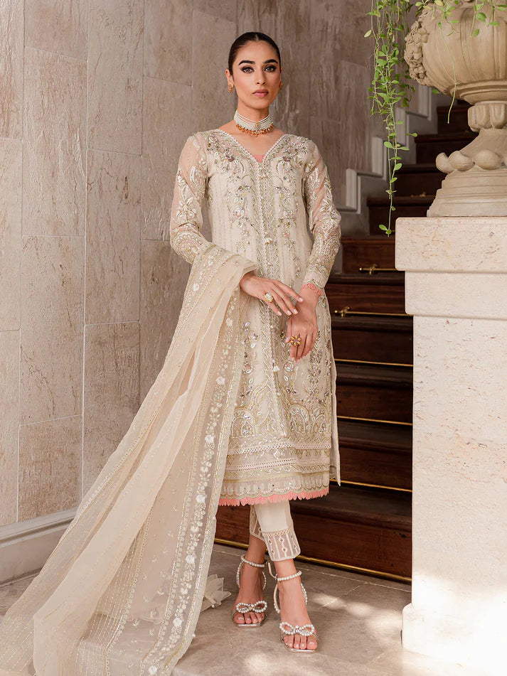 Model wearing ivory Yaram outfit from Gulaal—elegant Pakistani luxury pret, perfect for festive wear, shop Pakistani clothes online in UK.