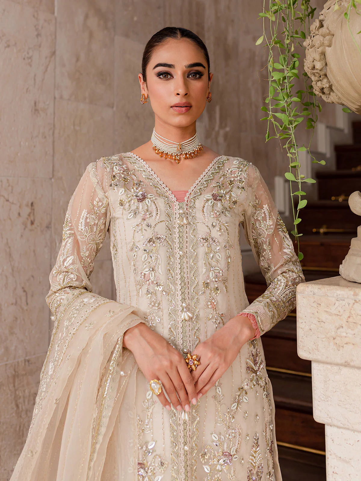 Model wearing ivory Yaram outfit from Gulaal—elegant Pakistani luxury pret, perfect for festive wear, shop Pakistani clothes online in UK.