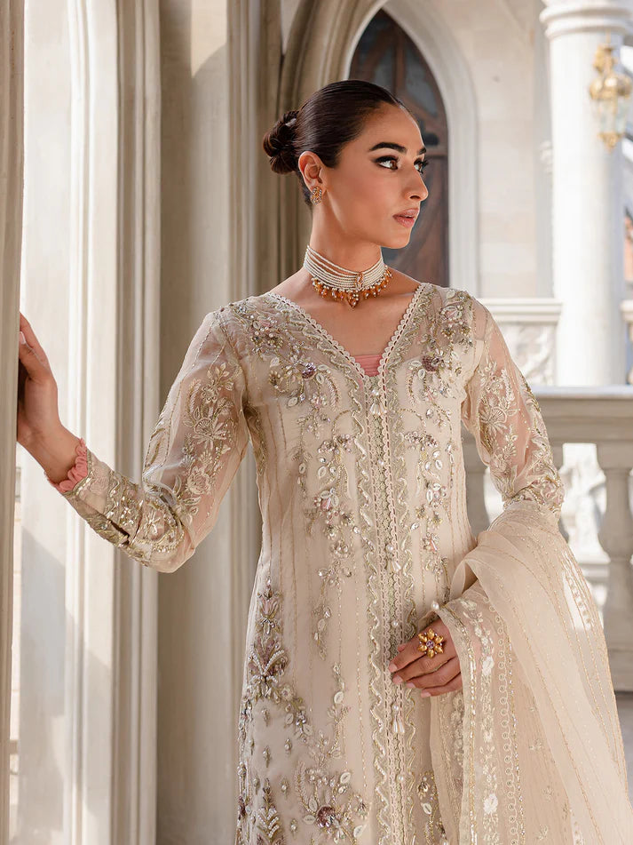 Model wearing ivory Yaram outfit from Gulaal—elegant Pakistani luxury pret, perfect for festive wear, shop Pakistani clothes online in UK.