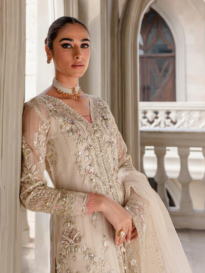 Model wearing ivory Yaram outfit from Gulaal—elegant Pakistani luxury pret, perfect for festive wear, shop Pakistani clothes online in UK.