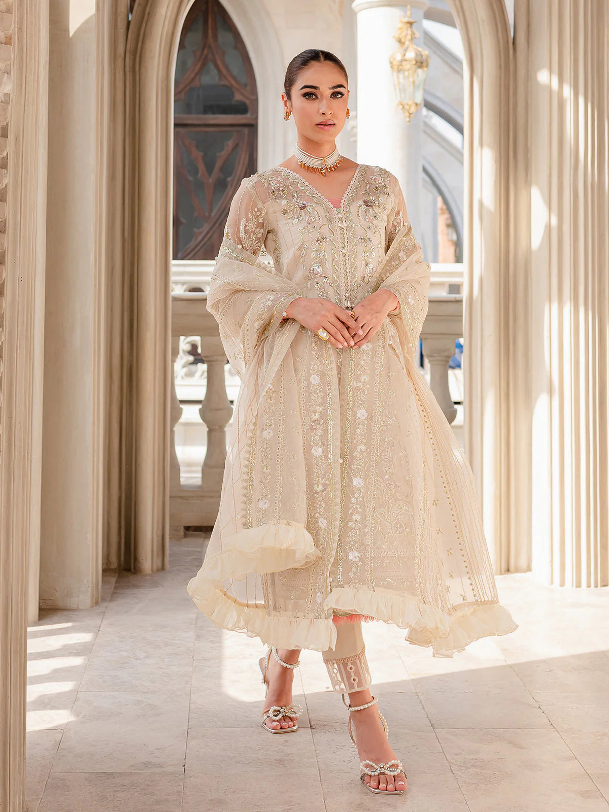 Model wearing ivory Yaram outfit from Gulaal—elegant Pakistani luxury pret, perfect for festive wear, shop Pakistani clothes online in UK.