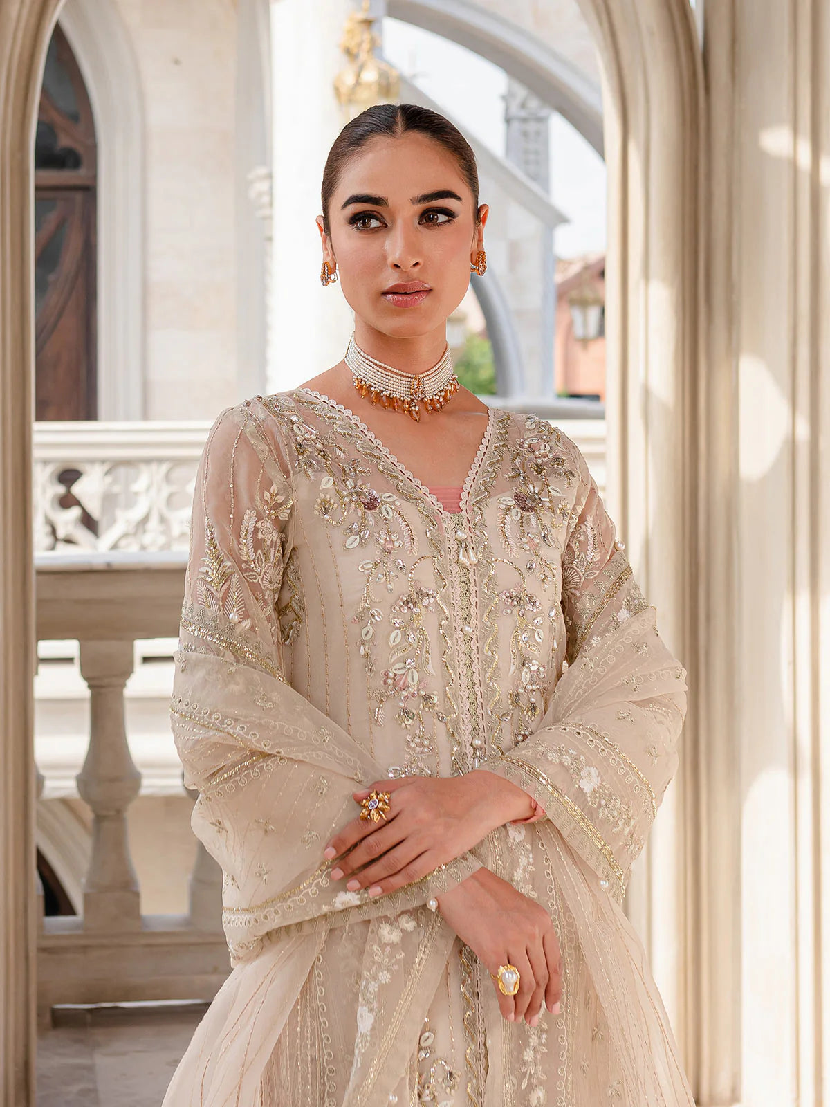 Model wearing ivory Yaram outfit from Gulaal—elegant Pakistani luxury pret, perfect for festive wear, shop Pakistani clothes online in UK.