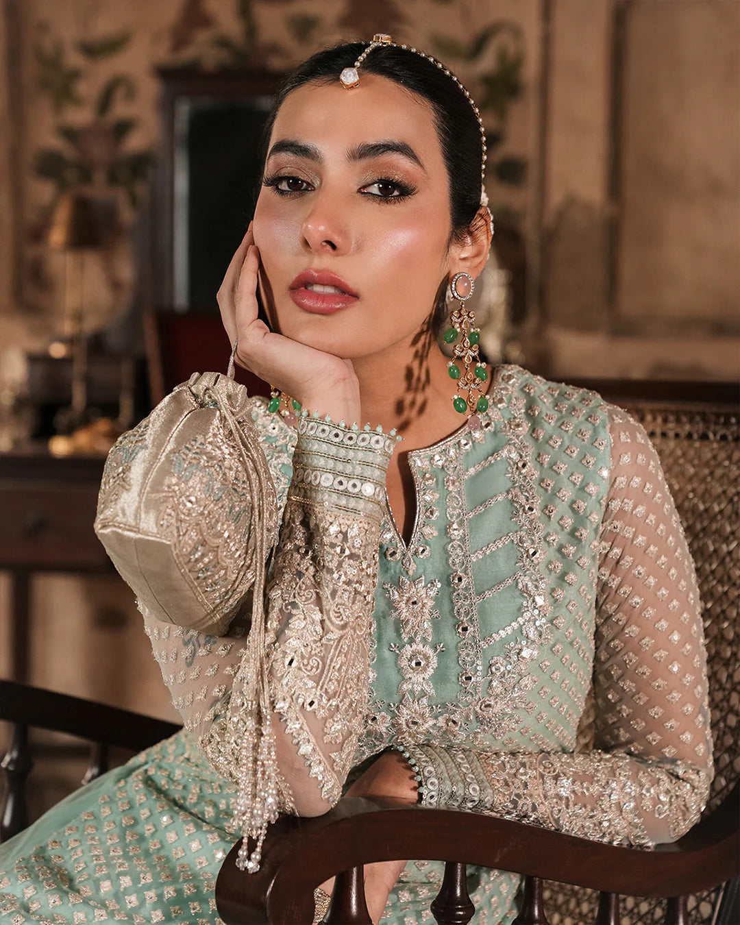 Model wearing mint green Faiza Saqlain Valari outfit with embellished net dupatta and lehenga, perfect for Pakistani luxury pret in UK.