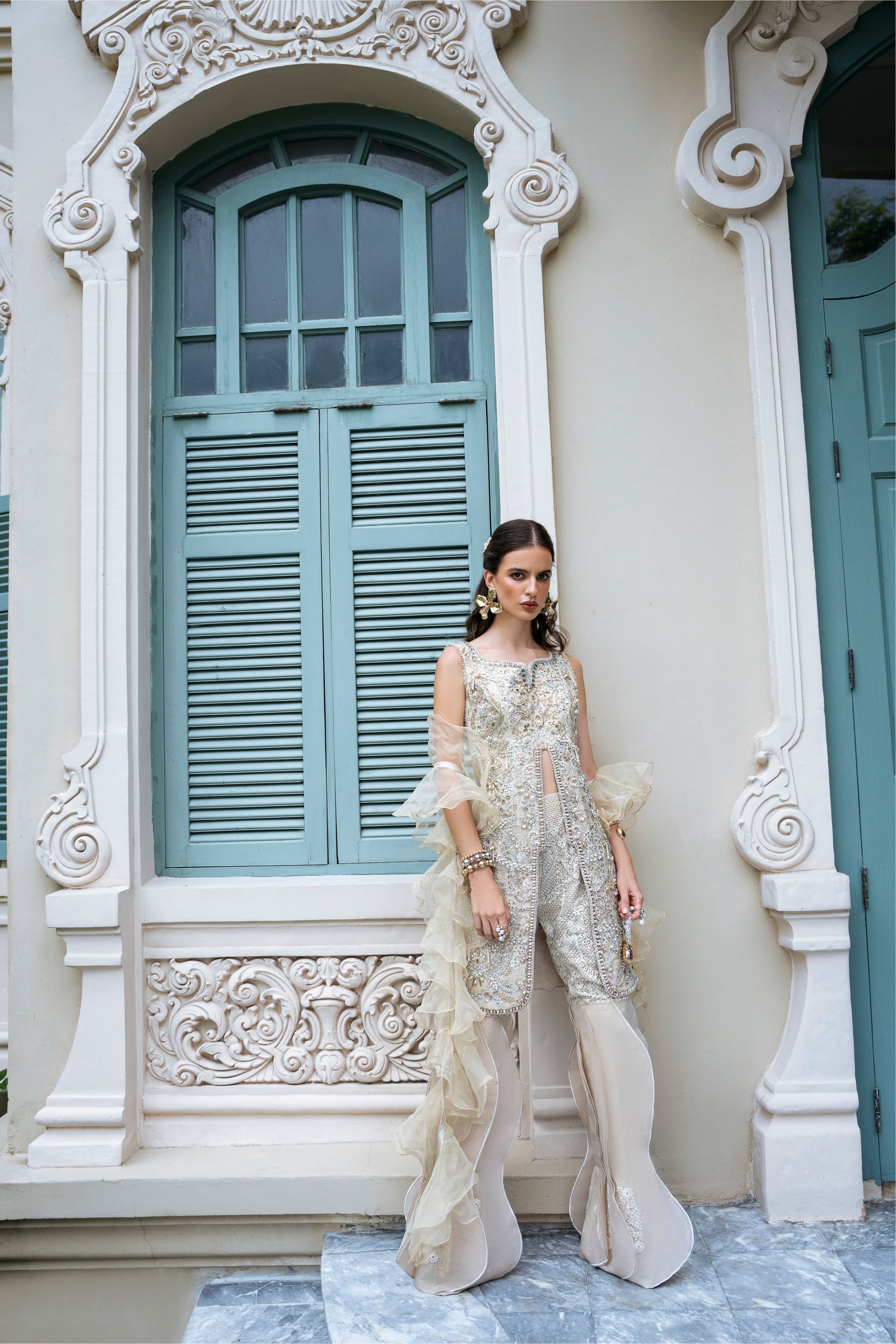 Model wearing Fifi from Mysie by Tahira, a beige embellished outfit with flared pants, perfect for Pakistani luxury pret in the UK.
