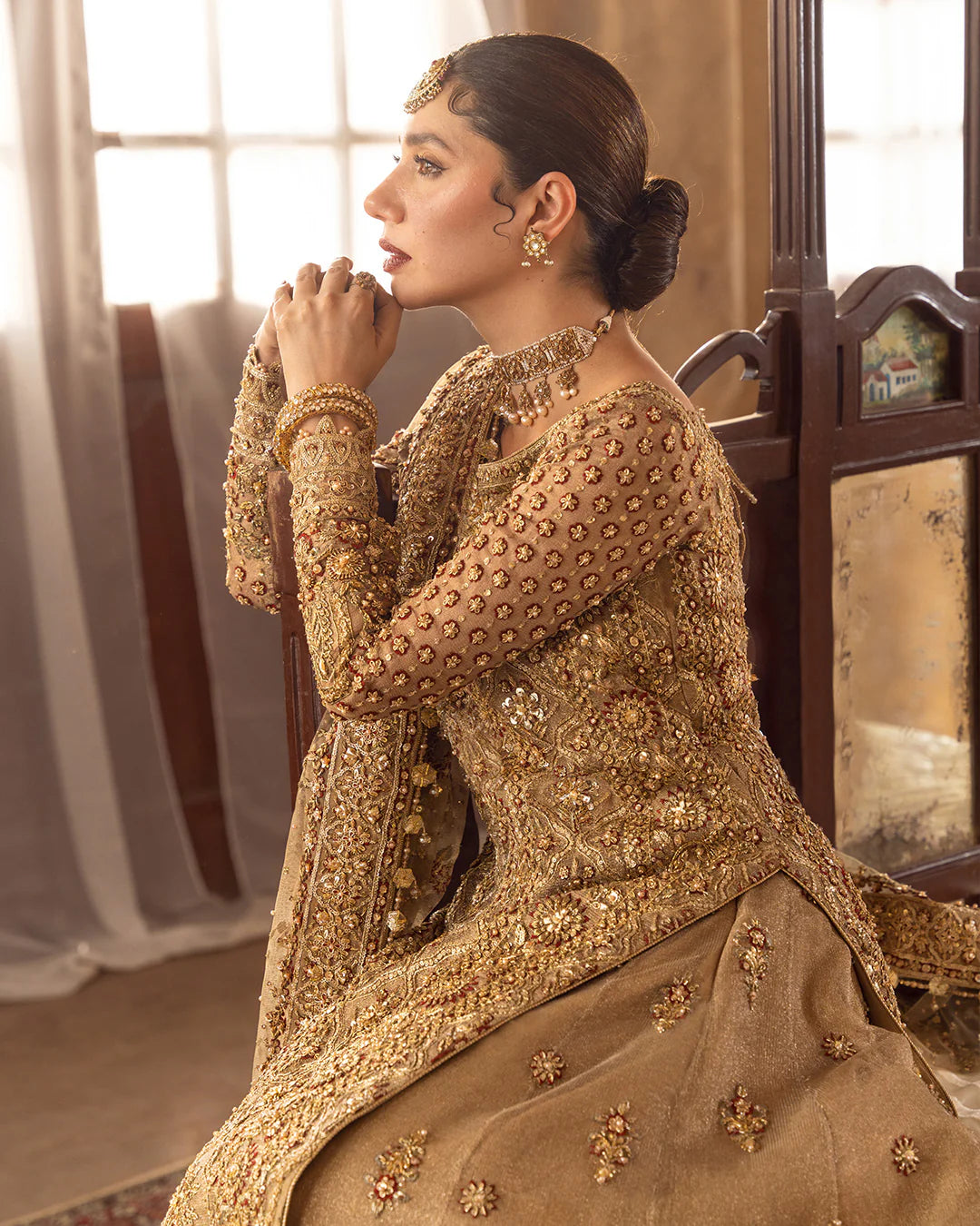 Model wearing golden brown bridal dress Naisha by Faiza Saqlain, Pakistani luxury pret online in UK for weddings.