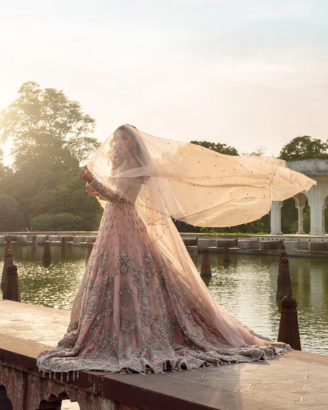 Model wearing dusty pink Aysana dress by Faiza Saqlain, Pakistani luxury pret online in UK for weddings and festive wear.