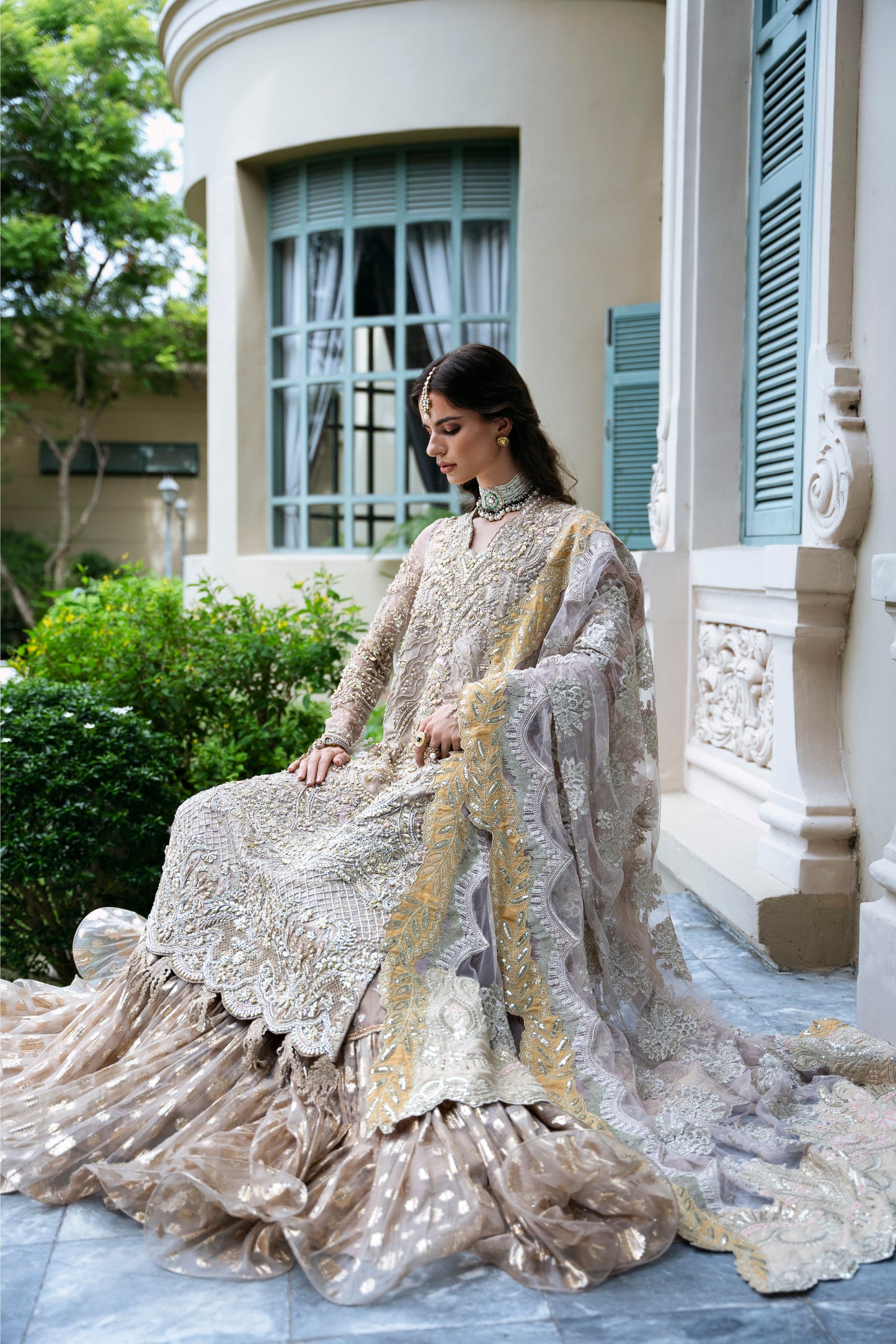 Model wearing PEONY from Mysie by Tahira, a soft beige and gold embellished ensemble, perfect for Pakistani luxury pret in the UK.