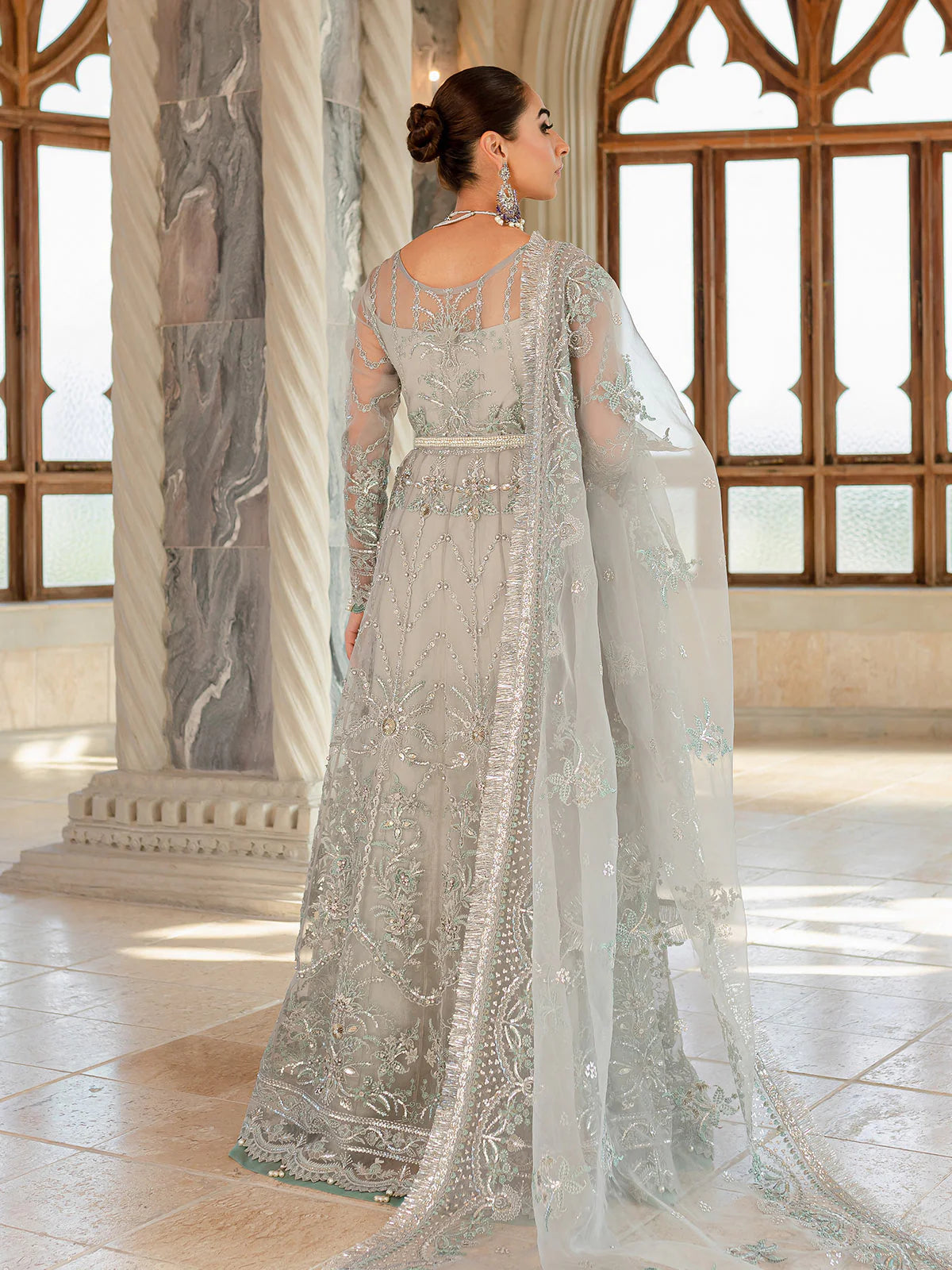 Model wearing silver-grey Naimaah GL-LP-V1-07 from Gulaal, featuring intricate embroidery—Pakistani luxury pret clothes online in UK.