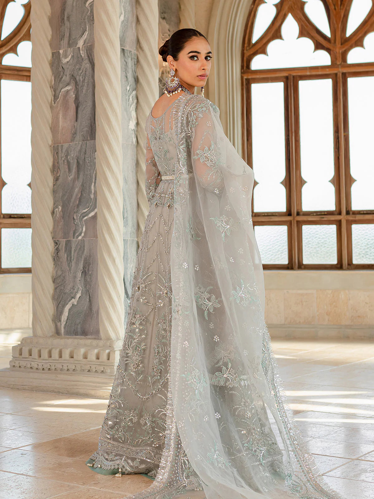 Model wearing silver-grey Naimaah GL-LP-V1-07 from Gulaal, featuring intricate embroidery—Pakistani luxury pret clothes online in UK.