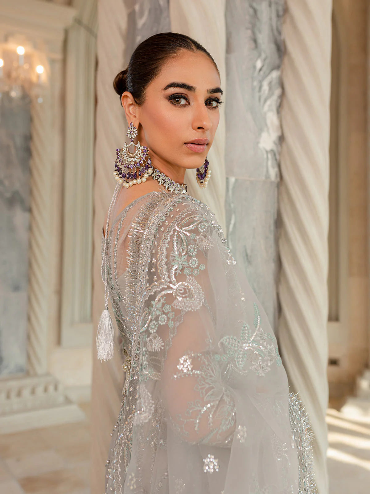 Model wearing silver-grey Naimaah GL-LP-V1-07 from Gulaal, featuring intricate embroidery—Pakistani luxury pret clothes online in UK.