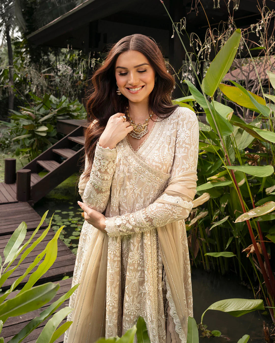 Model wearing ivory Ilima dress from Faiza Saqlain Zinnia collection, Pakistani Luxury pret, Pakistani clothes online in UK.