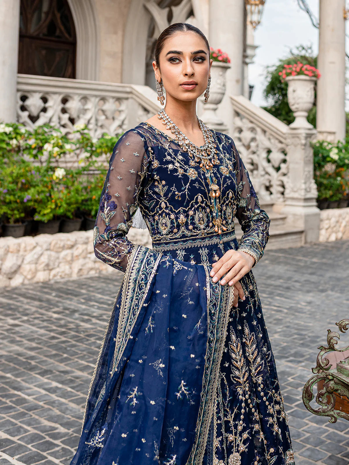 Model wearing navy blue Miray GL-LP-V1-08 from Gulaal, a heavily embroidered Pakistani luxury pret—shop Gulaal clothes online in UK.