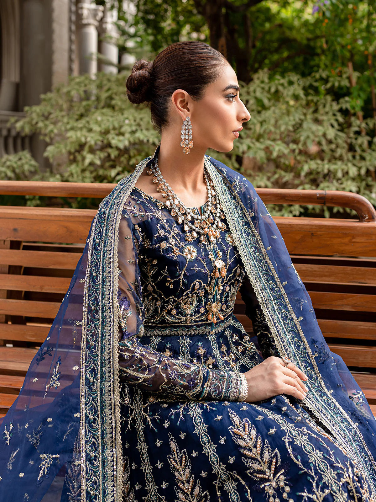 Model wearing navy blue Miray GL-LP-V1-08 from Gulaal, a heavily embroidered Pakistani luxury pret—shop Gulaal clothes online in UK.
