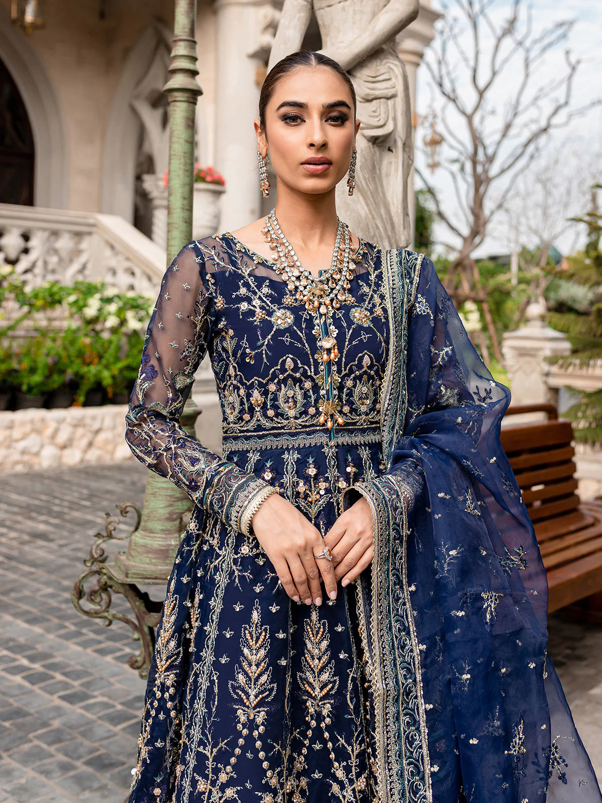 Model wearing navy blue Miray GL-LP-V1-08 from Gulaal, a heavily embroidered Pakistani luxury pret—shop Gulaal clothes online in UK.