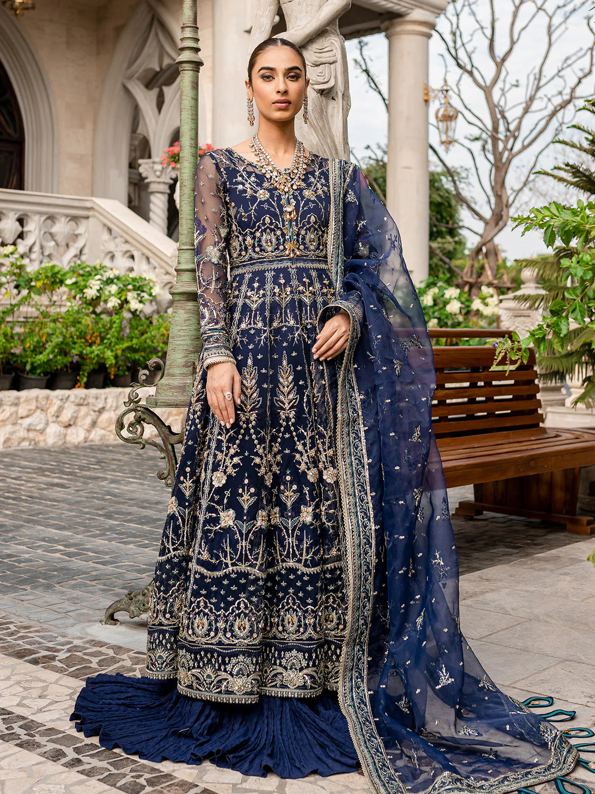 Model wearing navy blue Miray GL-LP-V1-08 from Gulaal, a heavily embroidered Pakistani luxury pret—shop Gulaal clothes online in UK.