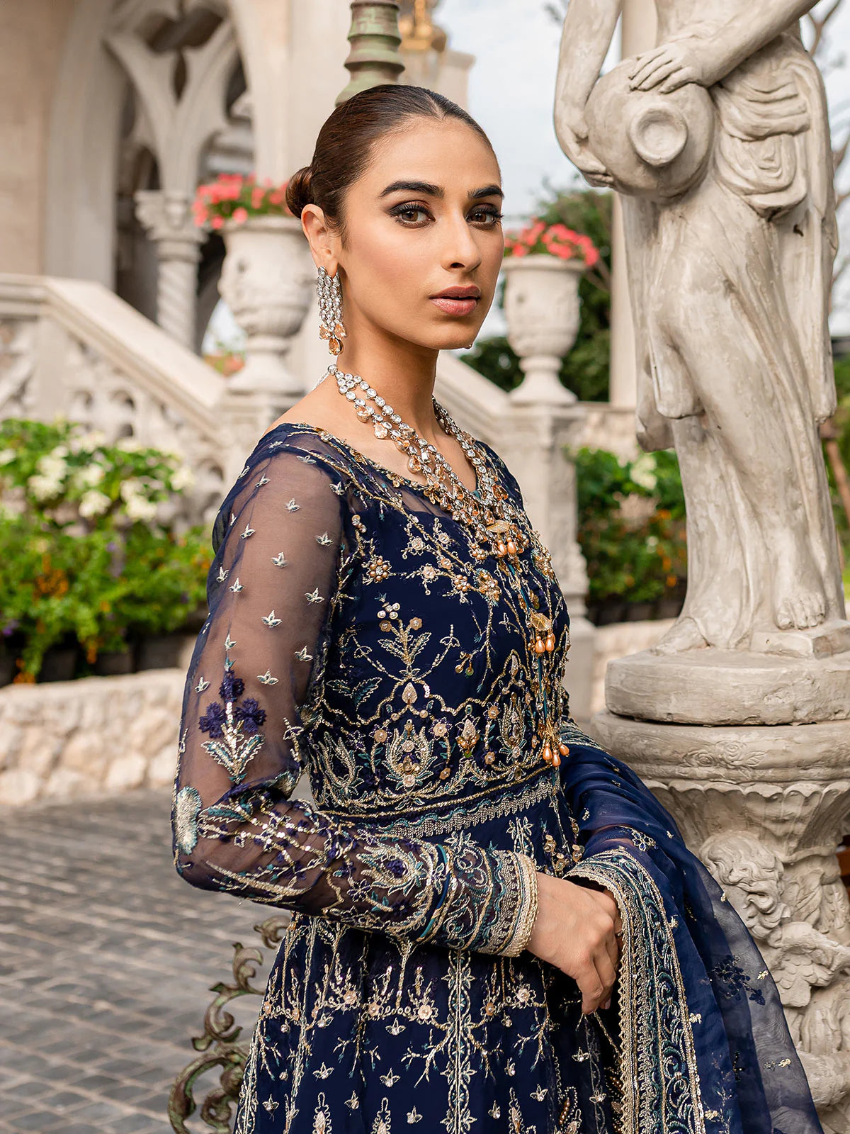 Model wearing navy blue Miray GL-LP-V1-08 from Gulaal, a heavily embroidered Pakistani luxury pret—shop Gulaal clothes online in UK.