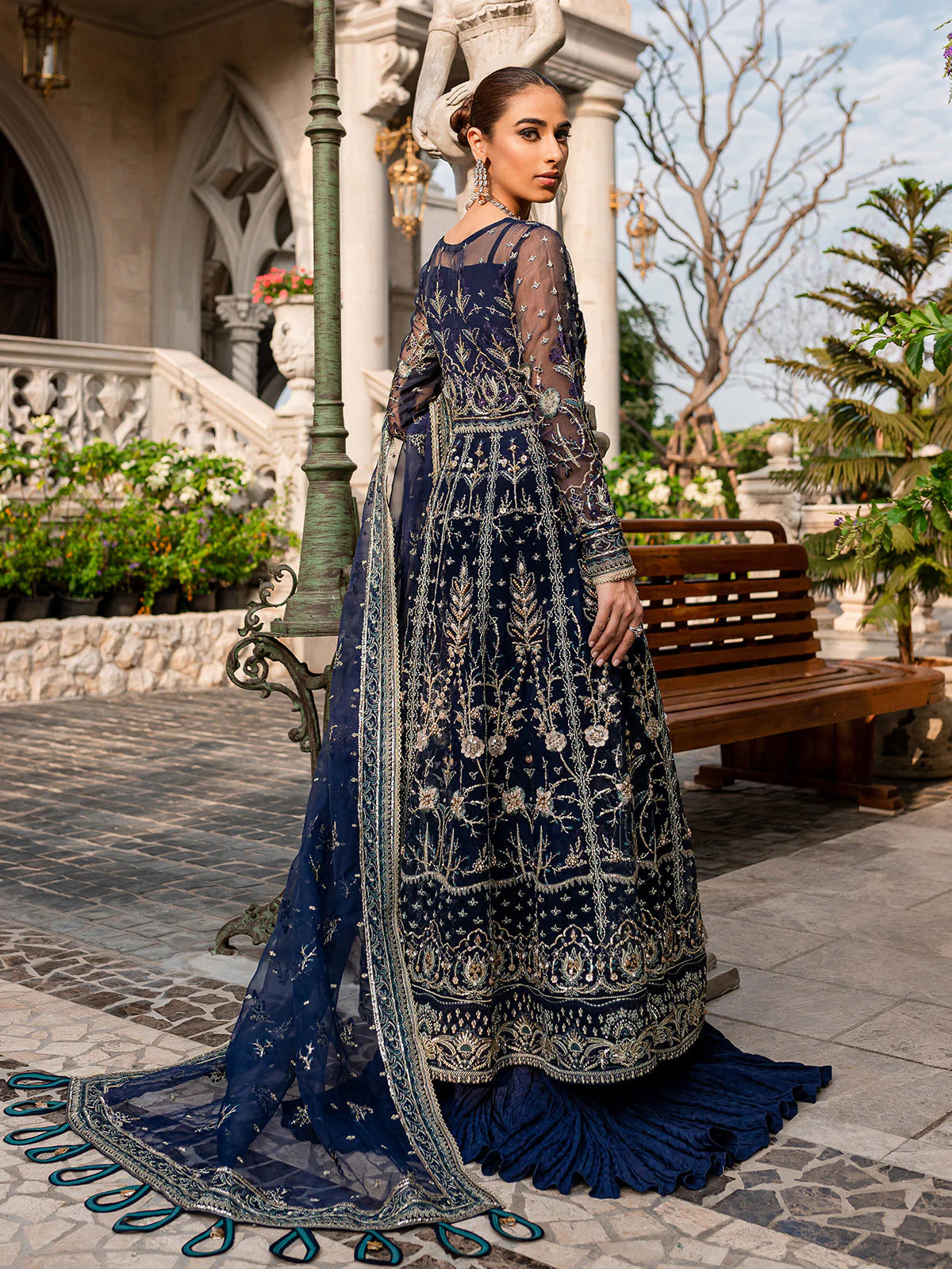 Model wearing navy blue Miray GL-LP-V1-08 from Gulaal, a heavily embroidered Pakistani luxury pret—shop Gulaal clothes online in UK.