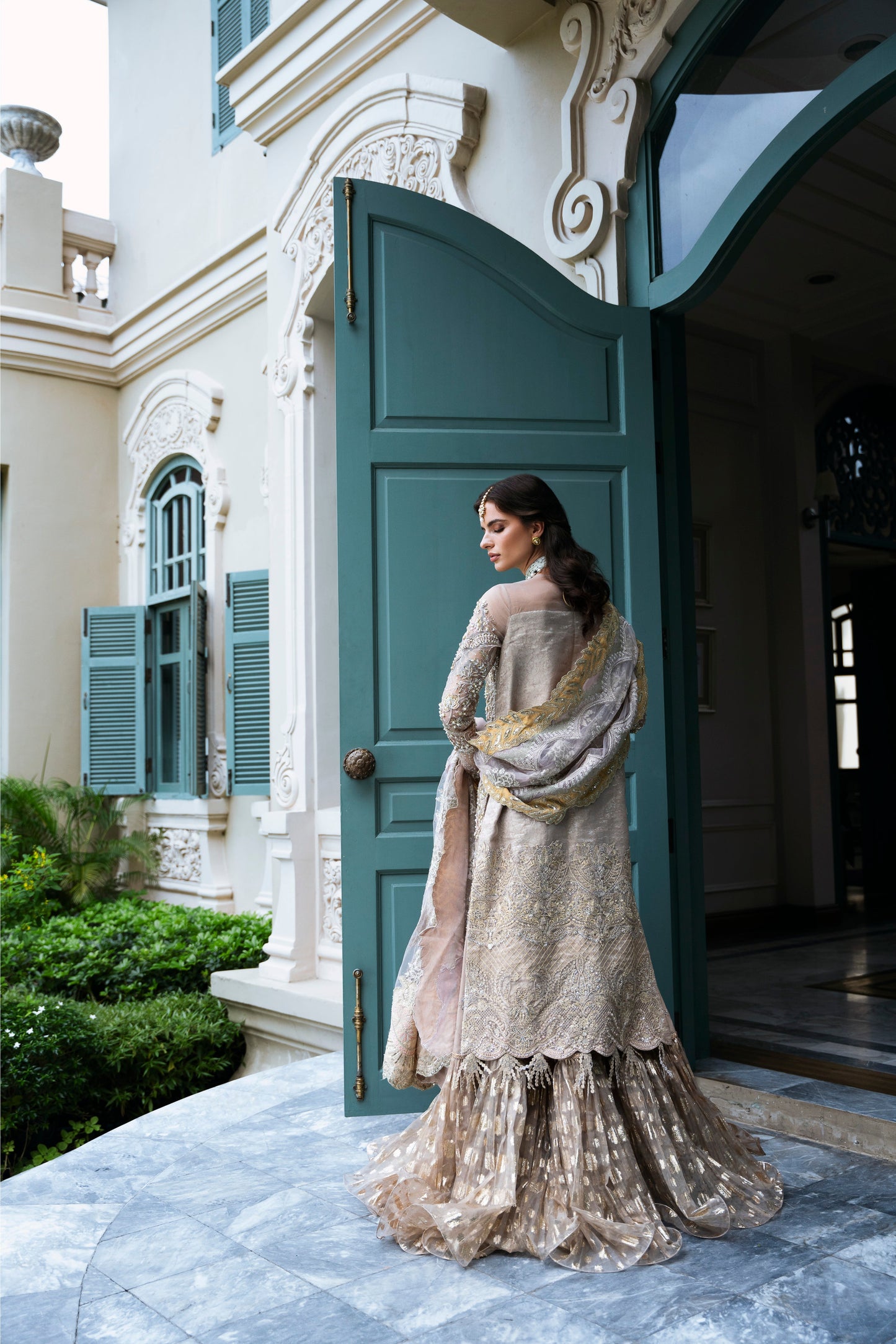 Model wearing PEONY from Mysie by Tahira, a soft beige and gold embellished ensemble, perfect for Pakistani luxury pret in the UK.