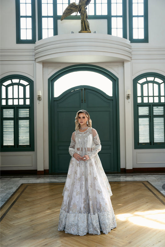 Model wearing Snowdrop from Mysie by Tahira, a stunning white and silver luxury pret outfit, perfect for Pakistani clothes in the UK.
