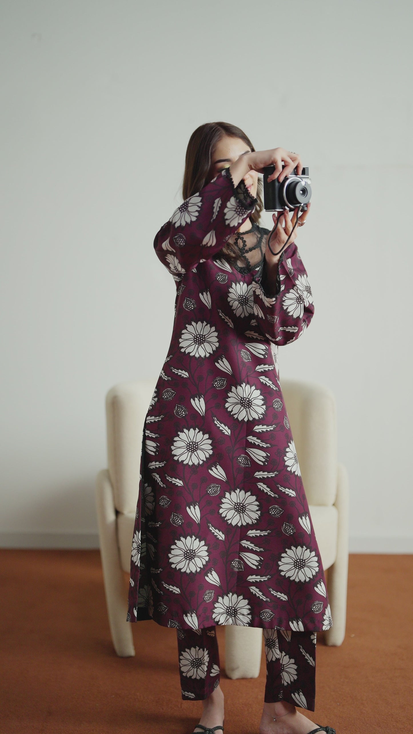 Model wearing Evra from Gulaal in a deep maroon printed co-ord set with bold white floral patterns, perfect for Pakistani luxury pret in the UK.