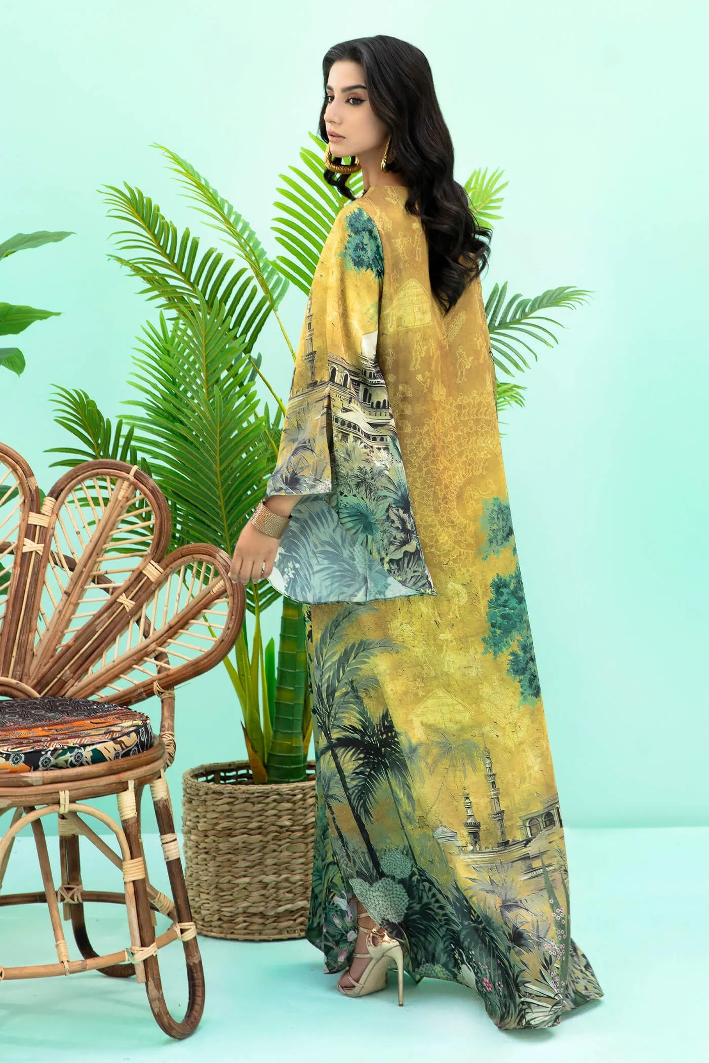 Model wearing mustard and green Aurelia dress from Musferah Saad's Resort collection '24, showcasing Pakistani clothes online in the UK.