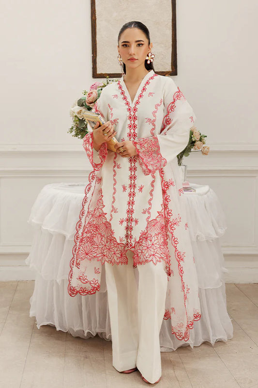 Model wearing Dewtide by Saffron in white with red floral embroidery – elegant Pakistani luxury pret outfit available online in UK.