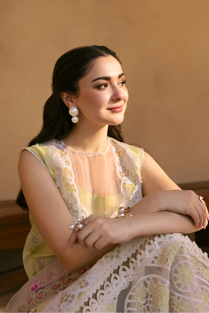 Model wearing pastel green and ivory embroidered long frock with floral dupatta from Saira Rizwan, Pakistani luxury pret, Pakistani clothes online in UK.