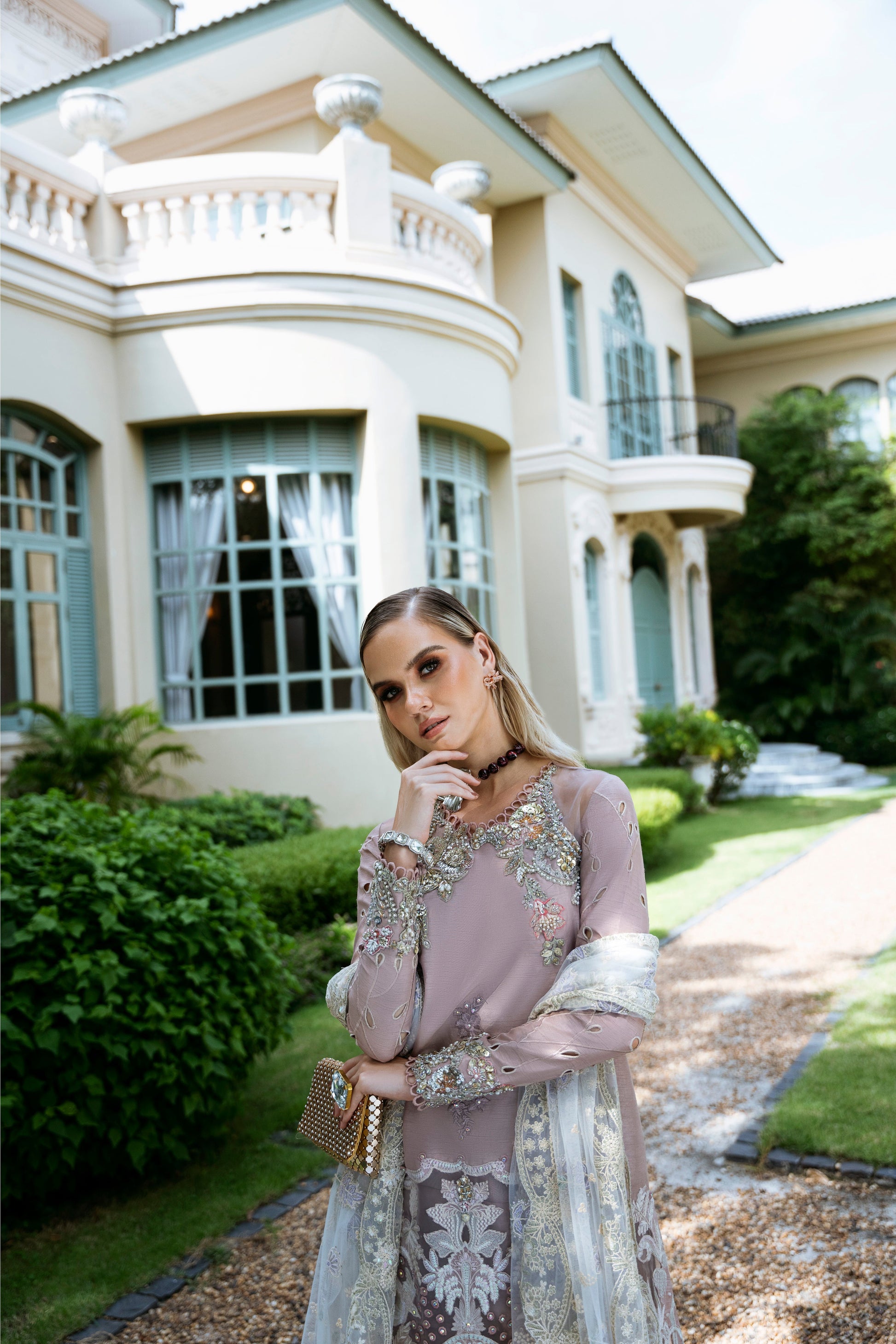 Model wearing Clara from Mysie by Tahira in beige luxury pret with intricate embroidery, perfect for Pakistani clothes online in UK.