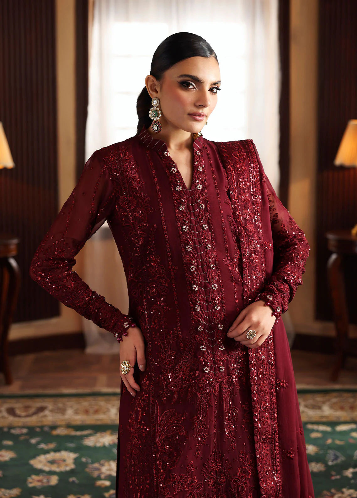 Model wearing Vezeen by Gulaal in deep maroon embellished chiffon – Pakistani luxury pret outfit available online in UK.