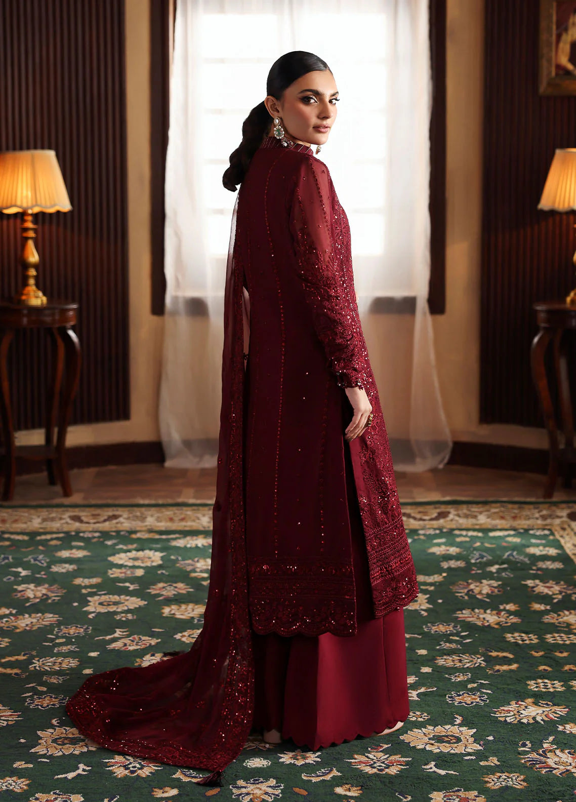 Model wearing Vezeen by Gulaal in deep maroon embellished chiffon – Pakistani luxury pret outfit available online in UK.