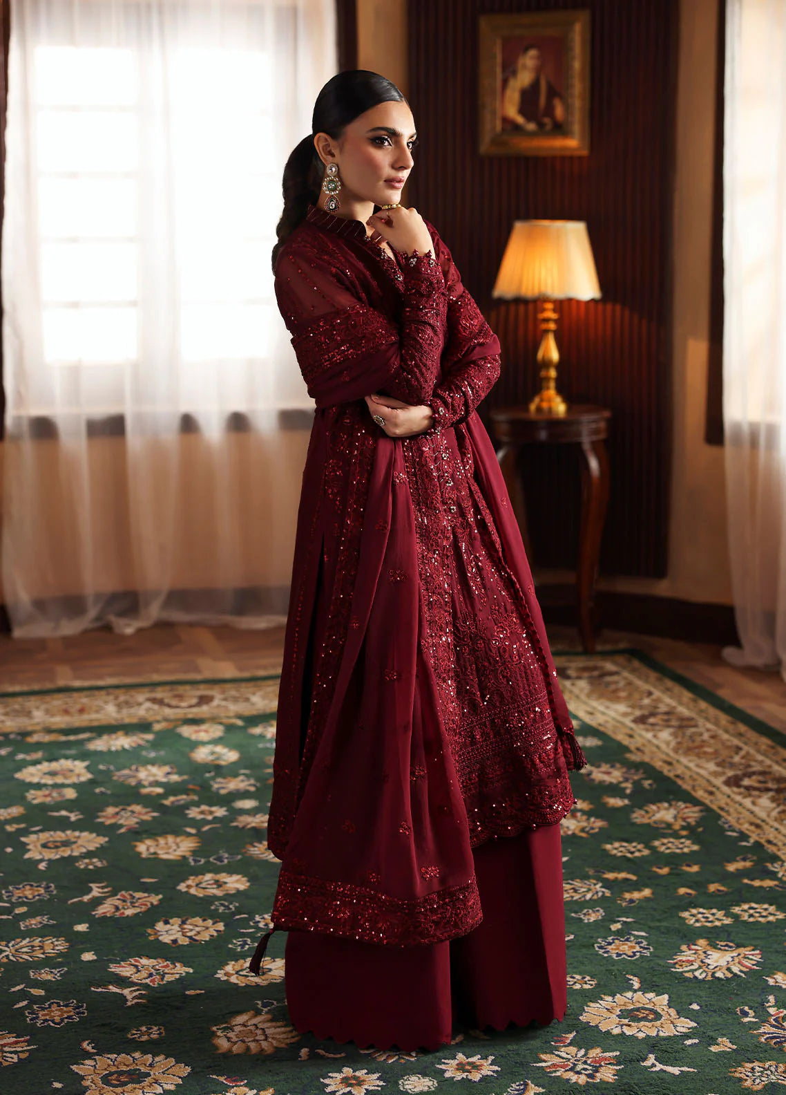 Model wearing Vezeen by Gulaal in deep maroon embellished chiffon – Pakistani luxury pret outfit available online in UK.