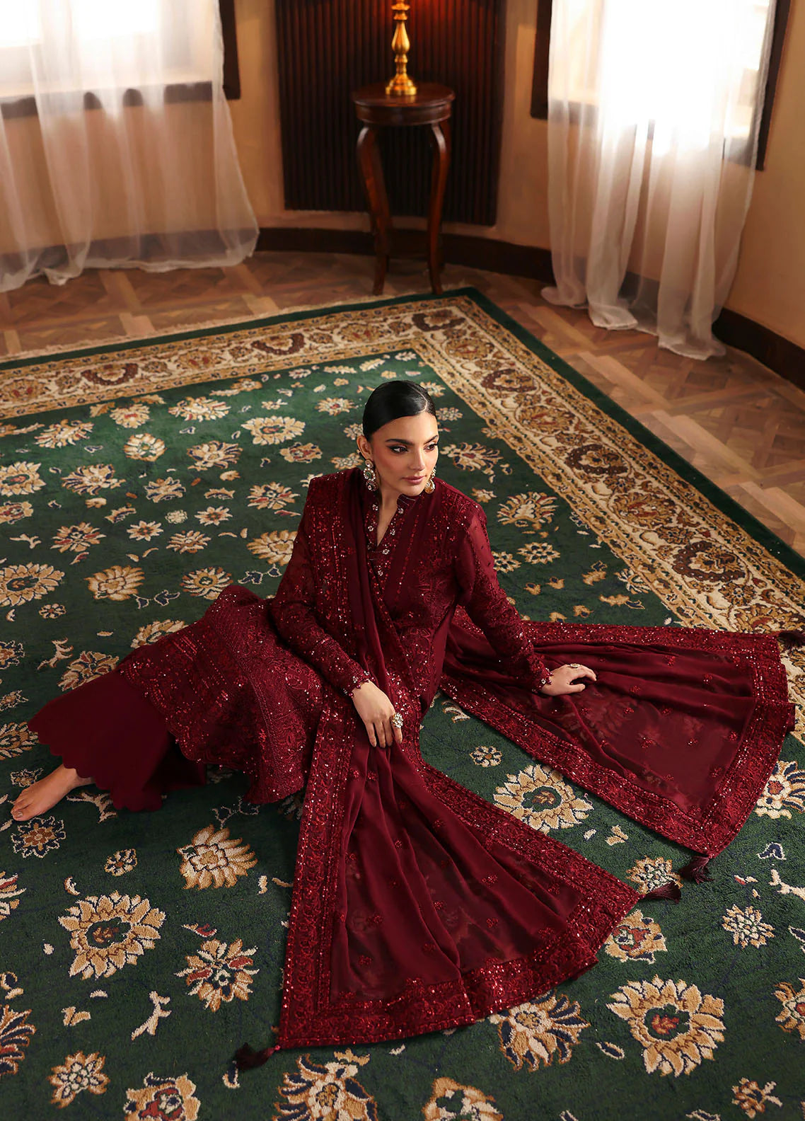 Model wearing Vezeen by Gulaal in deep maroon embellished chiffon – Pakistani luxury pret outfit available online in UK.