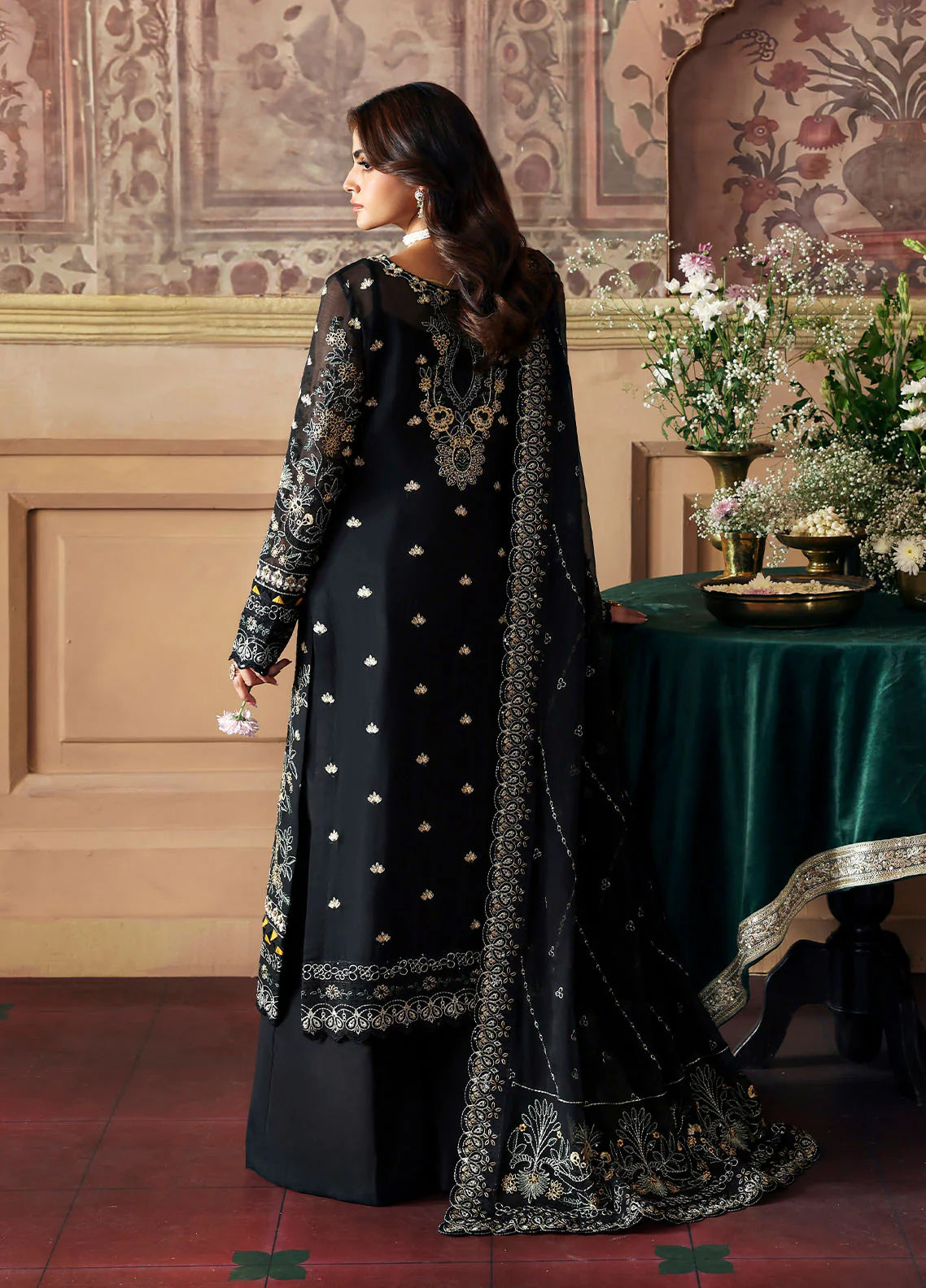 Model wearing Deenah by Gulaal in black with intricate gold chiffon embroidery – Pakistani luxury pret outfit online in UK.