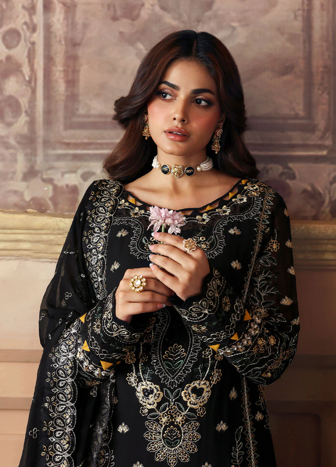 Model wearing Deenah by Gulaal in black with intricate gold chiffon embroidery – Pakistani luxury pret outfit online in UK.