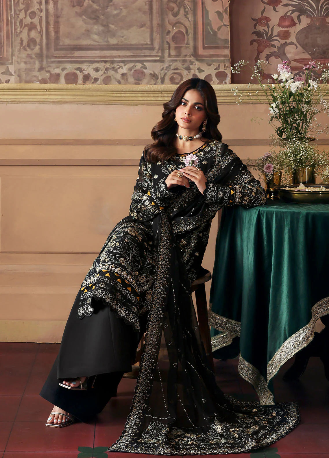 Model wearing Deenah by Gulaal in black with intricate gold chiffon embroidery – Pakistani luxury pret outfit online in UK.
