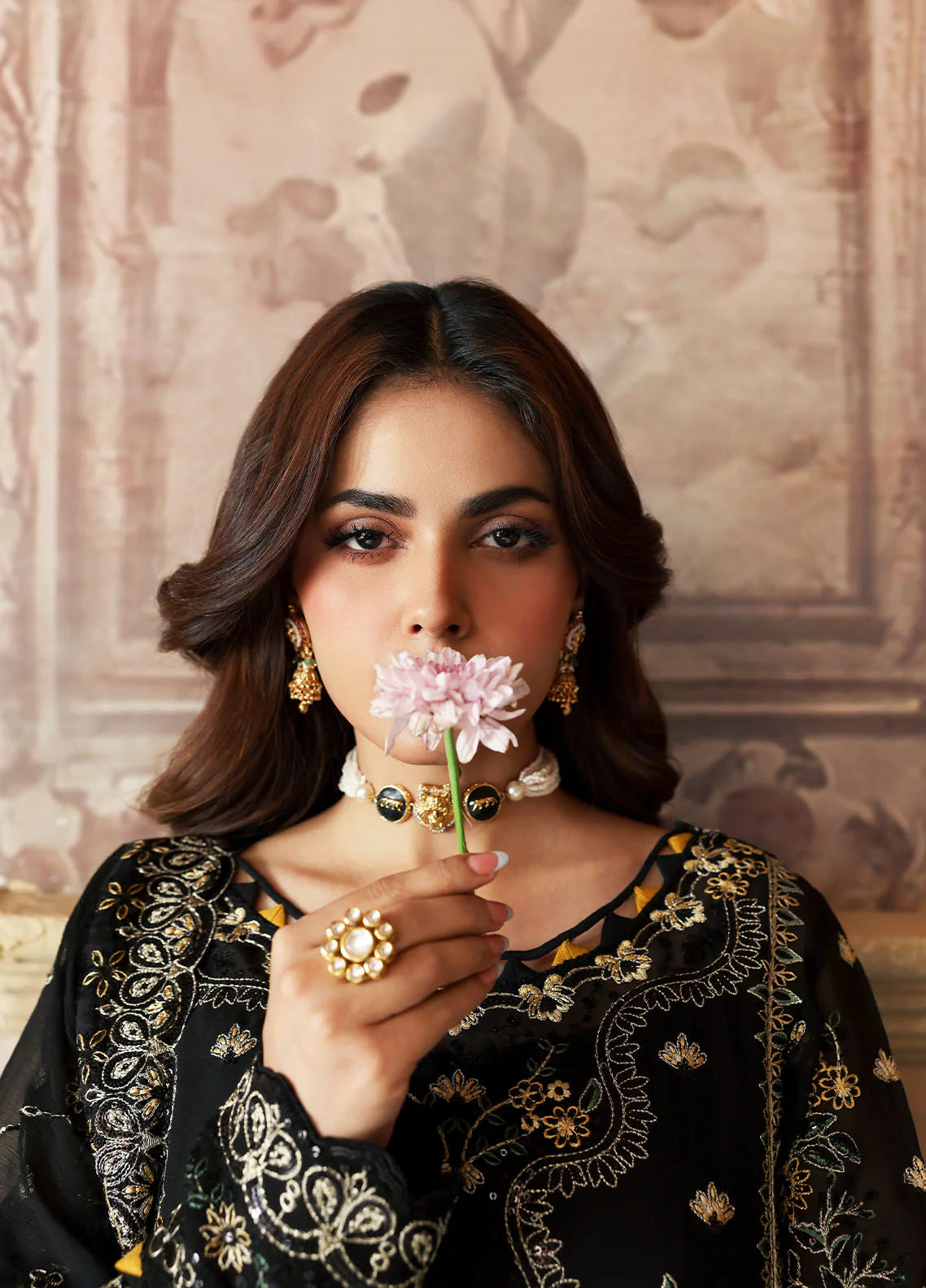 Model wearing Deenah by Gulaal in black with intricate gold chiffon embroidery – Pakistani luxury pret outfit online in UK.