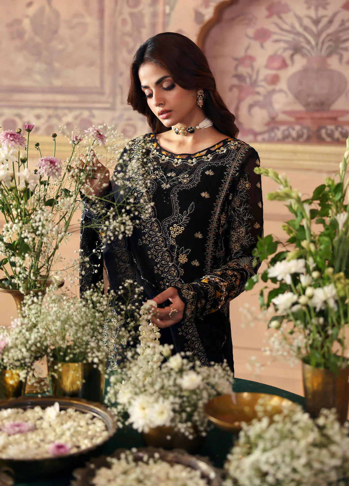 Model wearing Deenah by Gulaal in black with intricate gold chiffon embroidery – Pakistani luxury pret outfit online in UK.