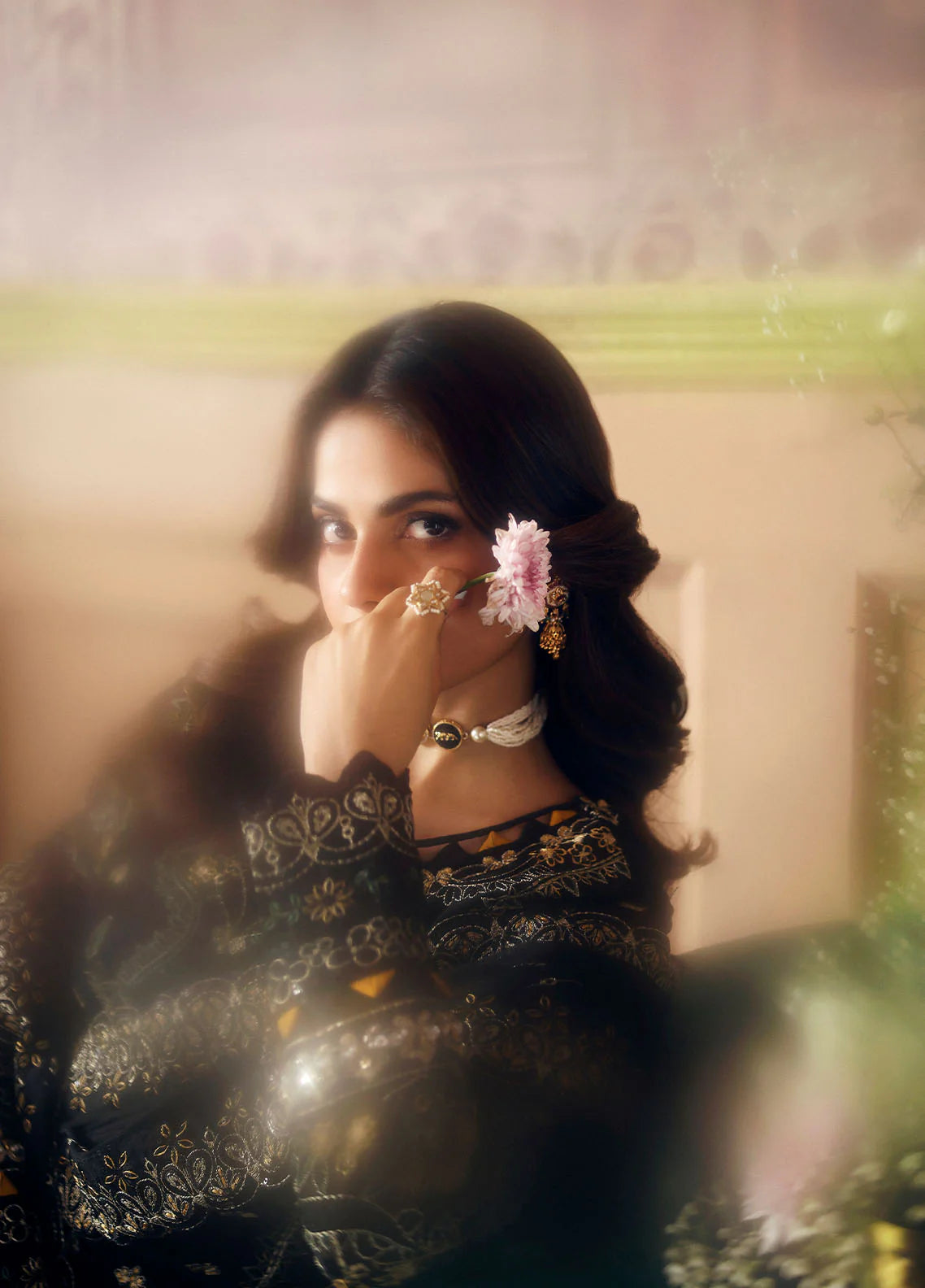 Model wearing Deenah by Gulaal in black with intricate gold chiffon embroidery – Pakistani luxury pret outfit online in UK.