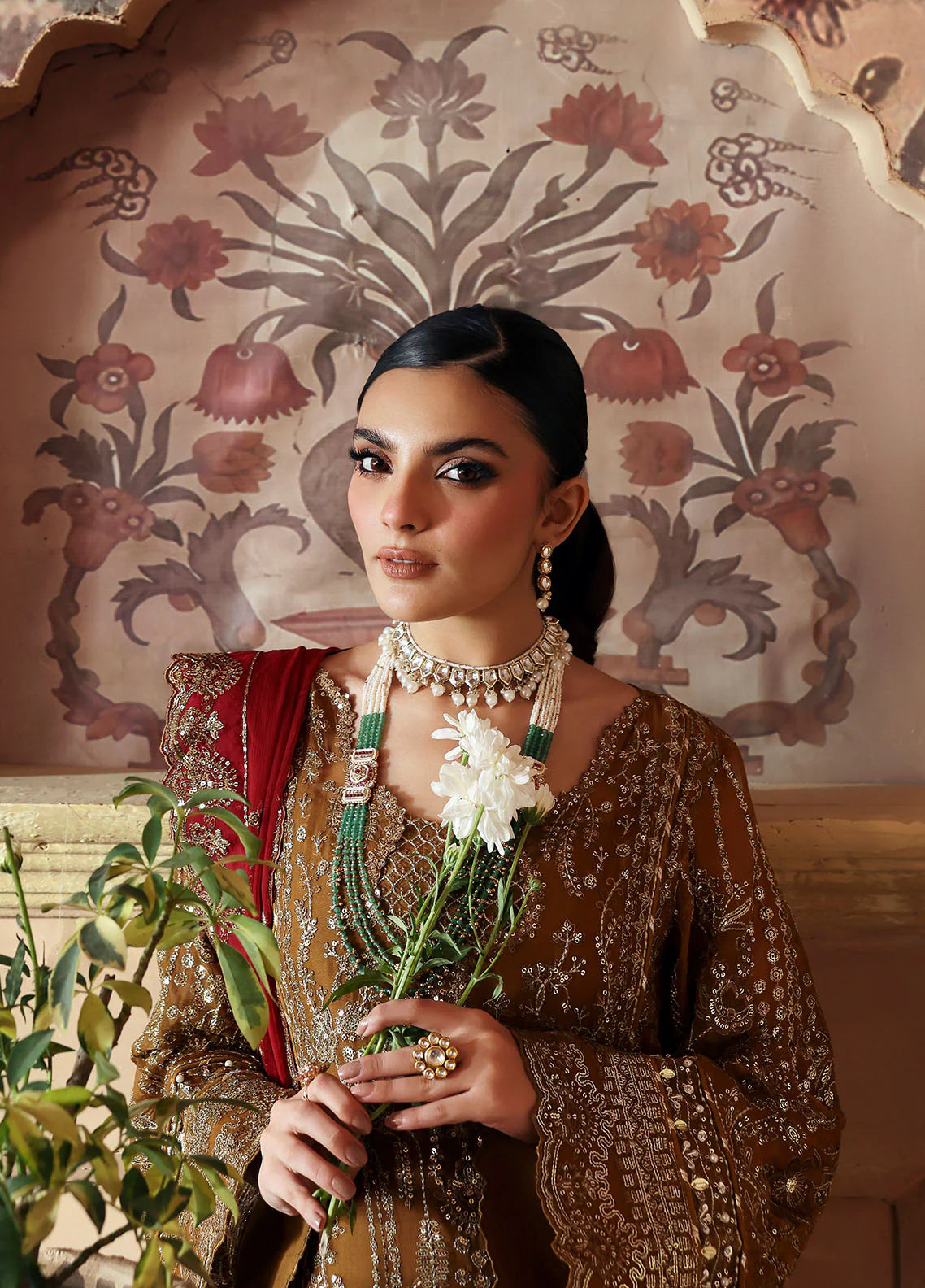 Model wearing Dinara by Gulaal in mustard and maroon with heavy chiffon embroidery – Pakistani luxury pret outfit online in UK.